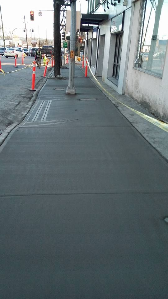 freshly paved concrete sidewalk for a local business in vancouver by Burnaby Blacktop