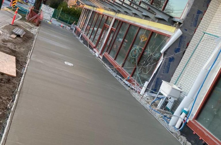 freshly poured concrete sidewalk for a commercial property