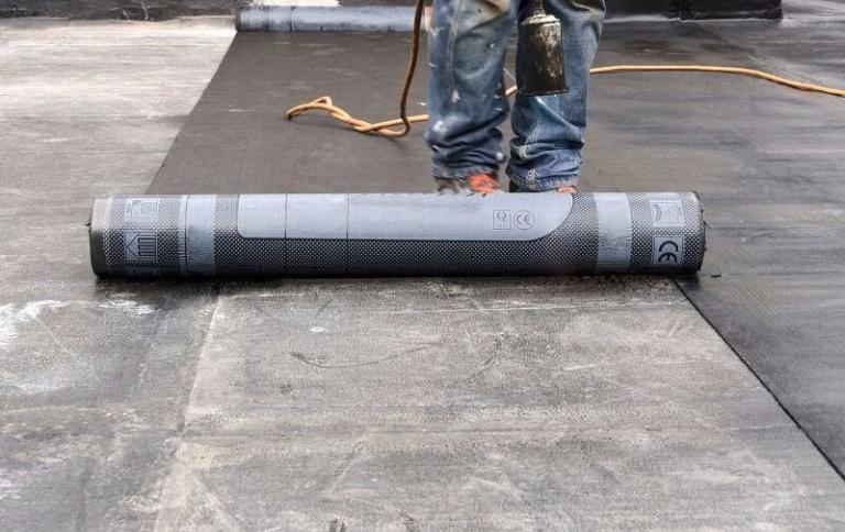 contractor installing parkade membrane