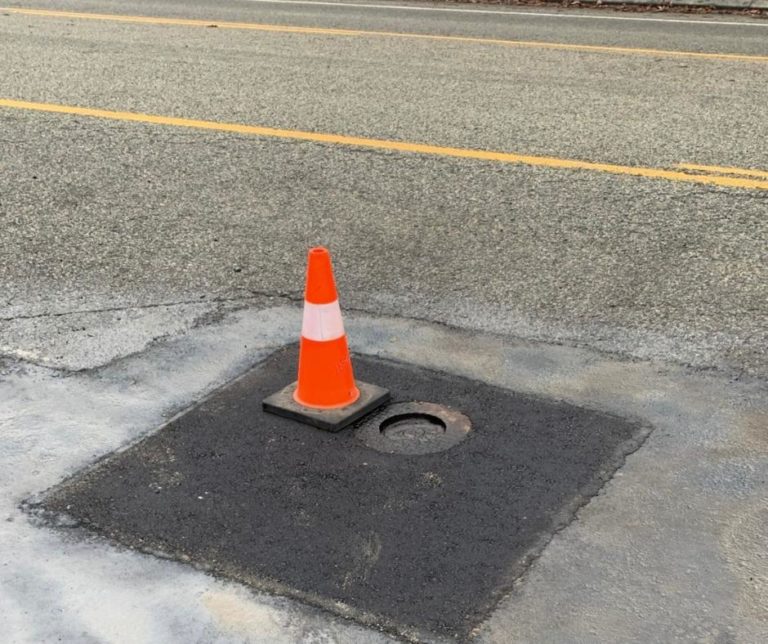pot hole repaired by Burnaby Blacktop + traffic cone