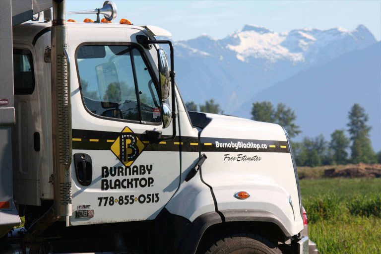 truck of burnaby blacktop with nice mountain background