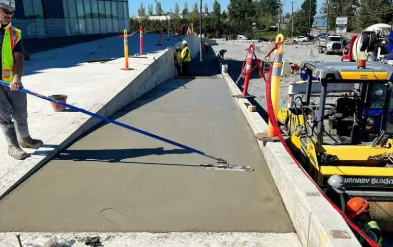 Concrete contractors in coquitlam working on a sidewalk