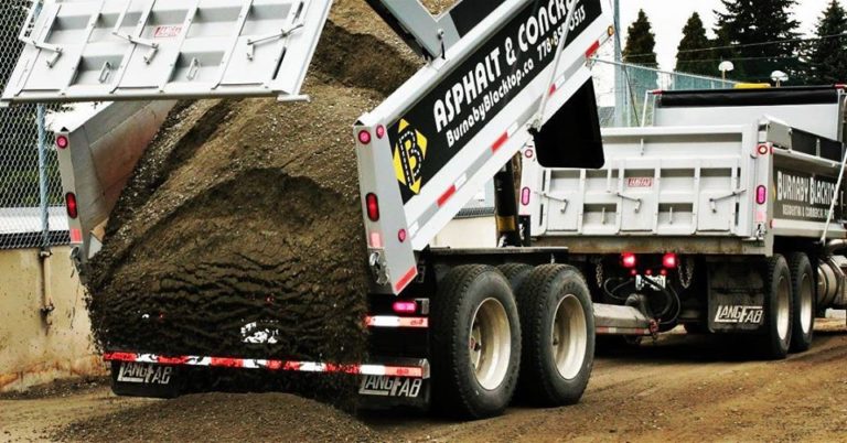 dump truck dumping materials for construction