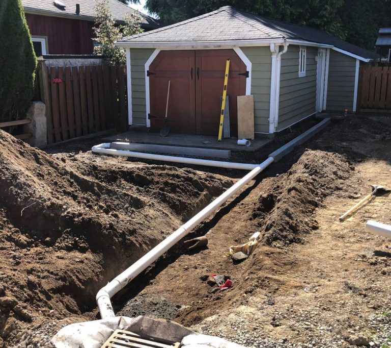 laneway house, excavated patio to install a drainage system