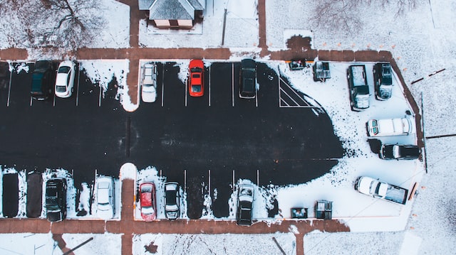 overhead view of a parking lot covered in snow