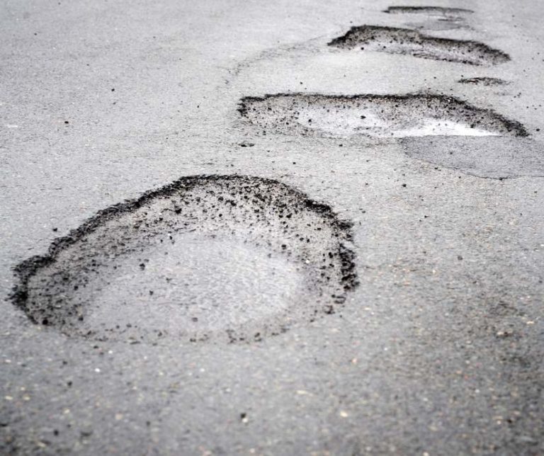 a road full of big pot holes