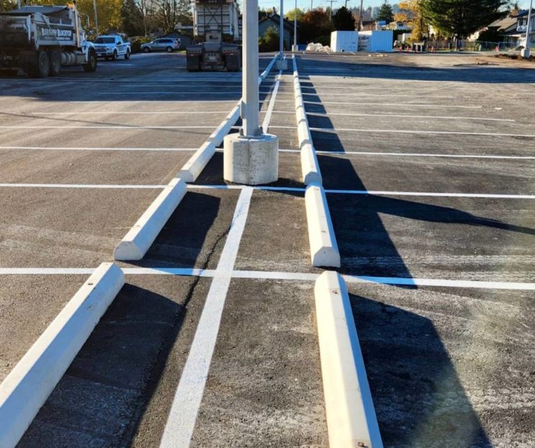 concrete curbs in a commercial parking lot by Burnaby Blacktop